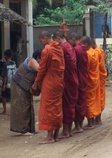Monks receiving alms