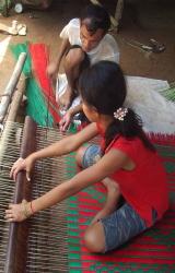 girl and father weaving